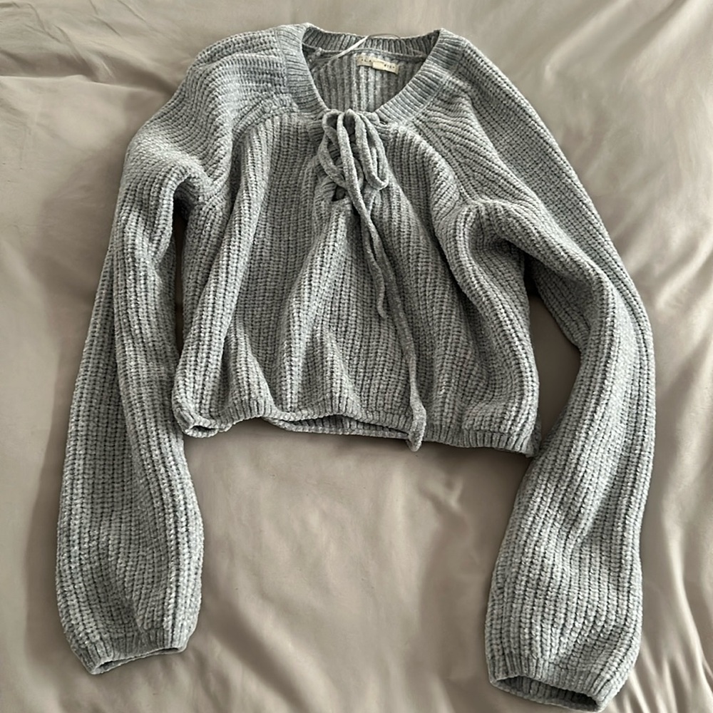 Light gray crop top with cross tie on chest
